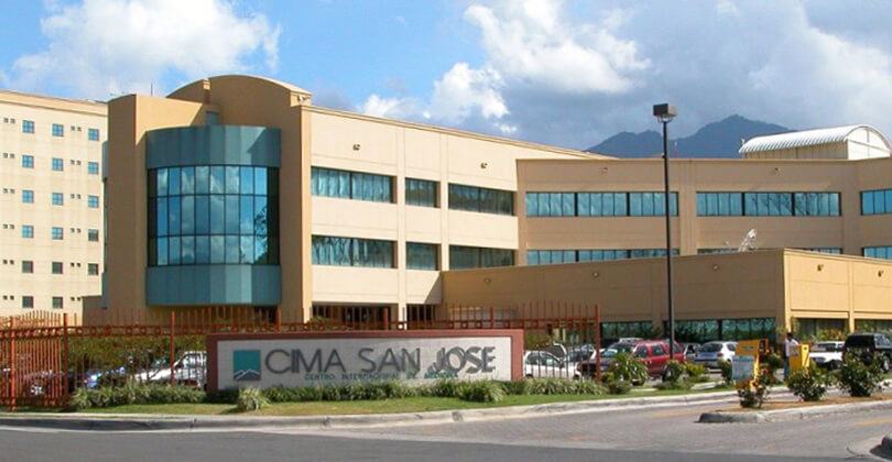 Picture of CIMA Hospital in San Jose, Costa Rica.. The picture shows a panoramic view of the large building and shows a CIMA Hospital sign in the front.